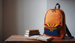 © Александр Бердюгин - Back to school and happy time! Pile of books and backpack with Arizona flag on the desk at the elementary school.