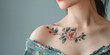Delicate Floral Tattoo on Woman's Shoulder. Close-up view of a woman's collarbone featuring a detailed floral tattoo in minimal style, copy space.