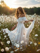Elegant Woman in Flowing Dress at Sunset