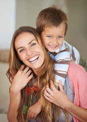 Sticker - Portrait, mother and son with smile on piggyback for mothers day, bonding and together inside. Happy woman, boy and laugh with flower, hug and love for playful weekend in family home New Zealand