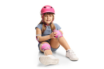 Sticker - Child with a helmet and knee pads sitting on the floor and crying in pain