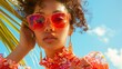 © pisan - Stylish Woman Wearing Orange Sunglasses and Floral Outfit on Sunny Day