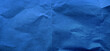 © WONGSAKORN - grunge old blue paper texture use as background with blank space for design. kraft blue wrinkle recycle paper background. rough paper texture for art concept.