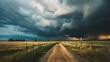 A dramatic thunderstorm rolling in over a rural landscape.