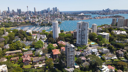 Wall Mural - Aerial drone view above the harbourside suburb of Darling Point looking toward Sydney Harbour and Sydney City on a sunny day