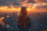 Fototapeta  - A lone woman gazes upon the towering skyscrapers, bathed in the warm hues of a sunset sky, contemplating the bustling city below and the endless possibilities that lie within its urban landscape