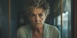 Elderly woman gazes through window with weary expression in home isolation. Concept Isolation, Elderly, Sadness, Loneliness, Home