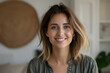 © Prasanth - Profile picture of happy millennial caucasian woman posing in own new home apartment. Close up headshot portrait of smiling female renter or tenant satisfied with real estate agency services.