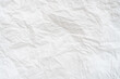 © nathamag11 - Wrinkled or crumpled white stencil paper or tissue paper after use with large copy space used for background texture