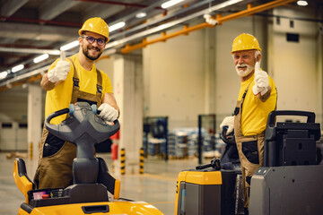 Wall Mural - Workers driving electric forklift at workplace