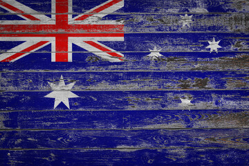 Wall Mural - The national flag of  Australia   is painted on uneven wooden  boards. Country symbol.