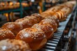 A mouth-watering assortment of freshly baked goods, from fluffy brioche to crispy koulourakia, glides along the indoor conveyor belt, tempting all with its delicious aroma and satisfying promise of a