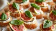 a close up of a plate of food with figs and cheese on bread with leaves on top of it.