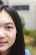 © Wavebreak Media - Close-up of a teenage Asian girl outdoors