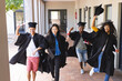 © Wavebreak Media - Diverse group of graduates celebrates outdoors, with copy space