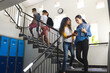 © Wavebreak Media - Diverse students walk in a high school stairwell