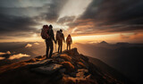 Fototapeta  - Three people on the top of mountain during golden hour. Group of hikers with backpacks walking in mountains at sunset