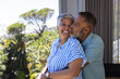 © Wavebreak Media - Senior biracial couple shares a tender moment at home