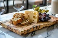 Olive Wood Cheese Board With Cheese, Grapes, Bread On A Luxurious Marble Tabletop