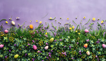 Easter Background, Colored Easter Eggs Lying In The Grass, Field Flowers, Easter Flowers Background, Fresh Green Spring Easter Background With Painted Eggs On A Green Grass