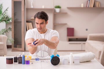 Wall Mural - Young man shaving face at home