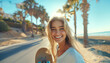 portrait of Cheerfull beautiful blonde hair young woman with skateboard, curly hair looking at camera on the seaside resort.Gorgeous human beauty, fashion, vacations and active lifestyle concept image