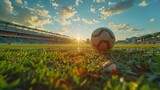 Fototapeta Sport - Football ball on the field in the stadium