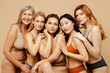 © Maria Vitkovska - Group portrait beautiful smiling multiethnic women hugging, wearing sexy lingerie isolated on beige background. Attractive stylish fashion models with perfect makeup looking at camera. Natural beauty