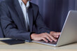 © unairakstudio - Businessman using laptop and typing on laptop computer keyboard in business success concept..