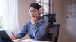 © snowing12 - Young asian student women wearing headphone to learning lecture webinar in online class on tablet while thoughtful about educational to writing notes and studying knowledge remote education from home