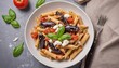 © Lupu - Pasta penne with eggplant. Pasta alla norma - traditional Italian food with eggplant, tomato, ricotta cheese and basil