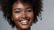 Black woman. Model with perfect smile and beautiful face isolated on grey. Portrait and beauty or skincare with cosmetology. Concept of face skin care.