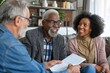 Elderly couple smiling while speaking with insurance consultant
