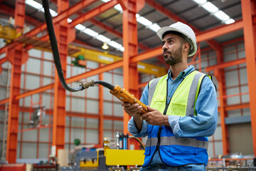 Sticker - worker or engineer operating remote switch to control machine in the factory