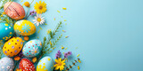 Fototapeta Niebo - Colorful Easter eggs on a blue pastel background with space for text.