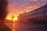 Fototapeta  - Sunrise bathes the school in warm light, marking the hopeful start of students' educational journey.