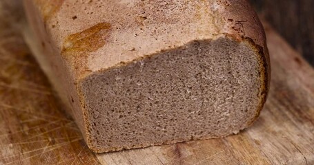 Wall Mural - rectangular fresh and soft bread on the table, a loaf of wheat and rye flour bread on the table