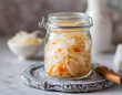 Homemade Sauerkraut in Glass Jar. Freshly prepared sauerkraut, rich in probiotics, ready for fermentation