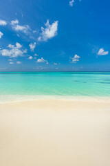 Wall Mural - closeup sand beach sea waves and blue summer sky. panoramic beach landscape. empty tropical beach an