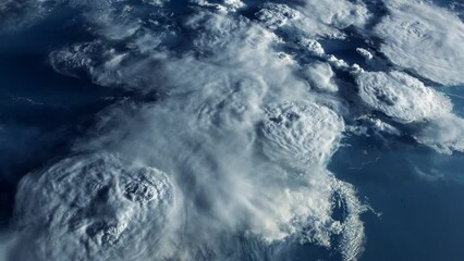Wall Mural - blue planet earth from space.stormy clouds forming a cyclone. view from international space station.