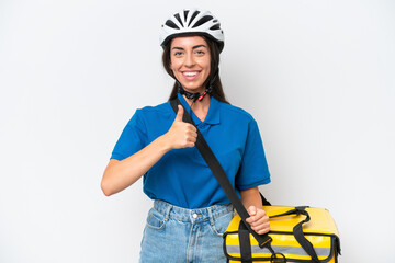 Wall Mural - Young caucasian woman with thermal backpack isolated on white background giving a thumbs up gesture