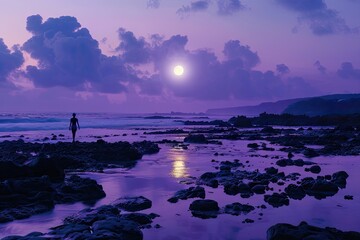 Poster - the moon lights is passing through dark clouds during nighttime while a young man is walking on small rocks beside an ocean