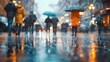 © Ziyan - Lots of people walking around the city. Blurred image, wide panoramic view of the road with people on a rainy day.
