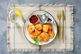Fototapeta Mapy - Chicken breast fried in batter or nuggets with chili sauce. top view