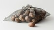 Potatoes in a net bag, isolated on white background