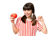 © luismolinero - Little caucasian girl holding an apple over isolated background proud and self-satisfied