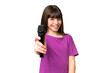 © luismolinero - Little singer girl picking up a microphone over isolated background with happy expression