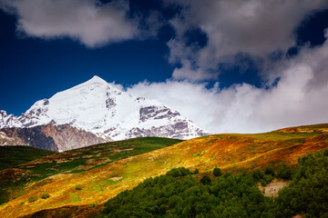 Poster - An incredible view of the snow-capped peak of the Main Caucasus Range. Upper Svaneti region, Georgia.