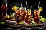 Fototapeta Uliczki - long island iced tea cocktail with strong drinks, cola, lime and ice in glass, cold long drink or lemonade