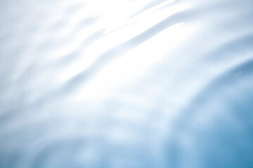 Wall Mural - the clear blue surface of the water gradients from light to dark.